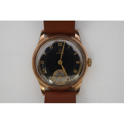 122 - A gentleman's 1940's 9ct gold Omega manual wind wrist watch, on a later associated leather strap, wi... 