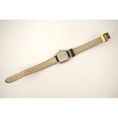 125 - A lady's steel and gold Cartier Panthere quartz wrist watch, now on an associated leather strap, but... 