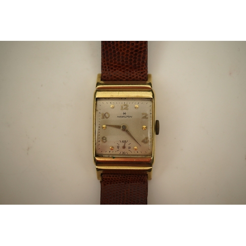 126 - A gentleman's 1950's? 14k gold Hamilton manual wind wrist watch, on a later associated leather strap... 