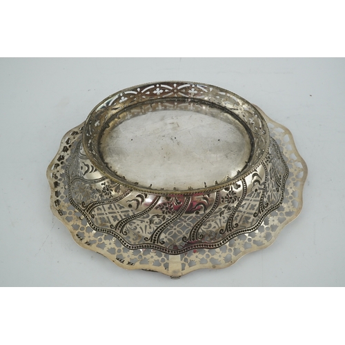 13 - A George III pierced repousse silver cake basket, of oval form, with wavy border and engraved armori... 