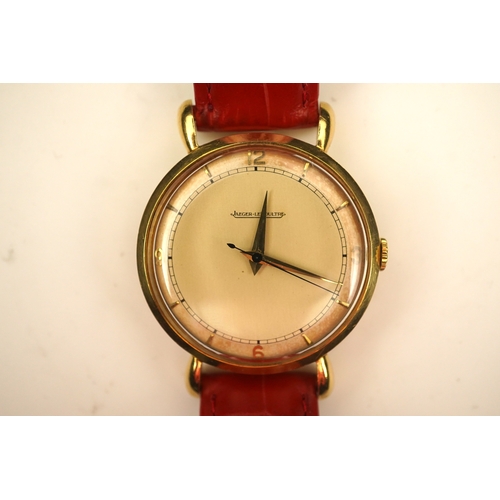 143 - A gentleman's 1950's 18ct gold Jaeger LeCoultre manual wind wrist watch, on a later associated leath... 