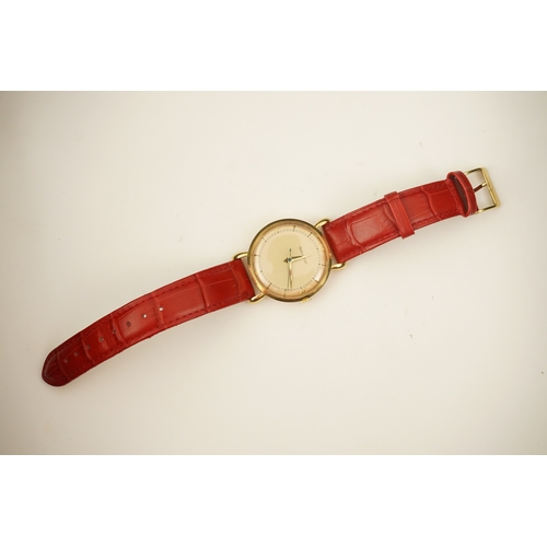 143 - A gentleman's 1950's 18ct gold Jaeger LeCoultre manual wind wrist watch, on a later associated leath... 