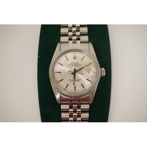 144 - A gentleman's early 1980's stainless steel Rolex Oyster Perpetual Datejust wrist watch, on a stainle... 