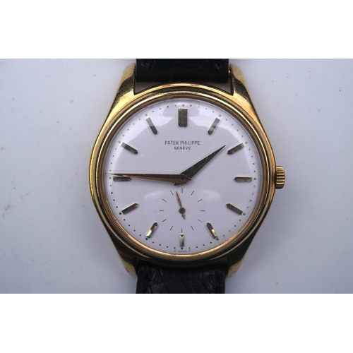 147 - A gentleman's fine 18ct gold Patek Philippe Calatrava automatic wrist watch, model number 2526, on a... 