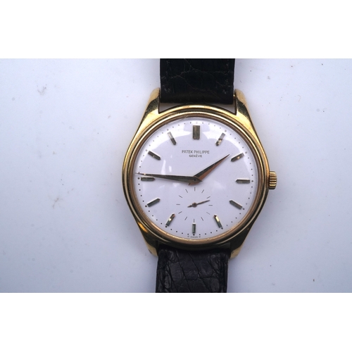 147 - A gentleman's fine 18ct gold Patek Philippe Calatrava automatic wrist watch, model number 2526, on a... 