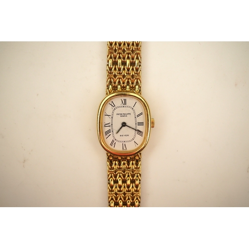 148 - A lady's 18ct gold Patek Philippe manual wind wrist watch, on an integral 18ct gold Patek Philippe b... 