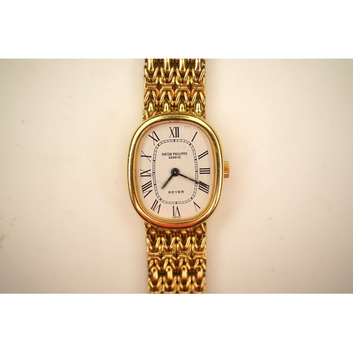 148 - A lady's 18ct gold Patek Philippe manual wind wrist watch, on an integral 18ct gold Patek Philippe b... 