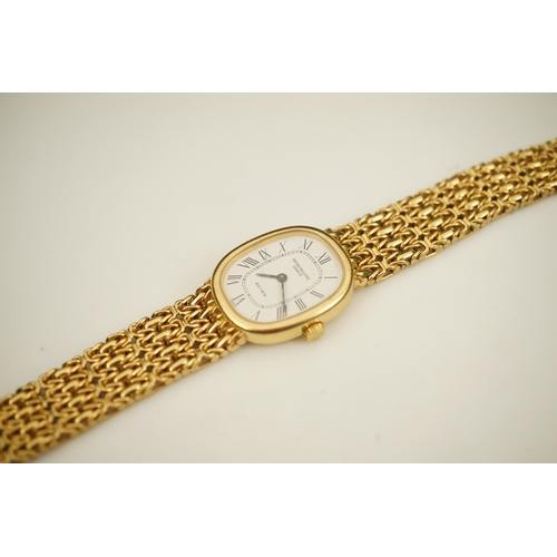 148 - A lady's 18ct gold Patek Philippe manual wind wrist watch, on an integral 18ct gold Patek Philippe b... 