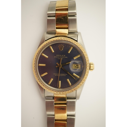 149 - A gentleman's early 1980's stainless steel and gold Rolex Oyster Perpetual Date wrist watch, on a st... 