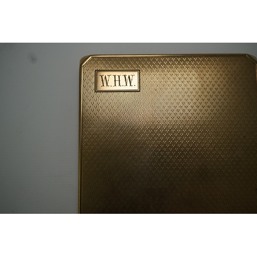 153 - A 9ct gold cigarette case, circa 1930 of square outline, the exterior with engine turned decoration ... 