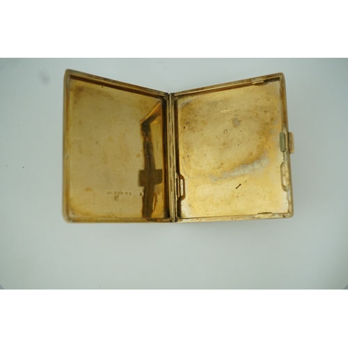 153 - A 9ct gold cigarette case, circa 1930 of square outline, the exterior with engine turned decoration ... 