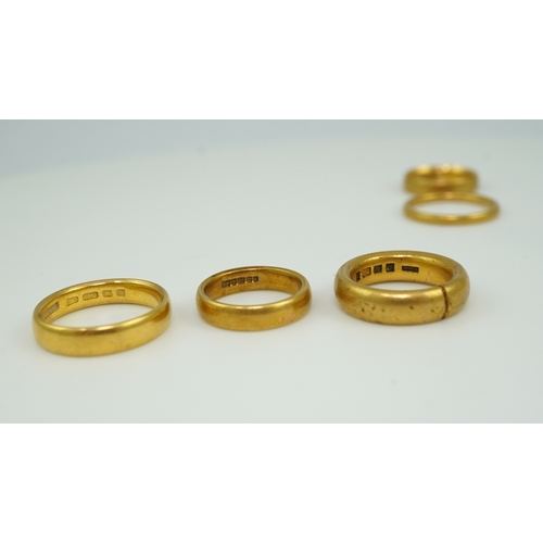 157 - Five 22ct gold wedding bands, each with British hallmarks, combined gross weight 33 grams