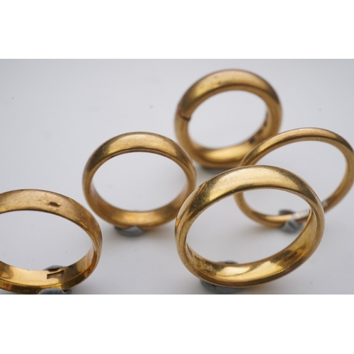 157 - Five 22ct gold wedding bands, each with British hallmarks, combined gross weight 33 grams