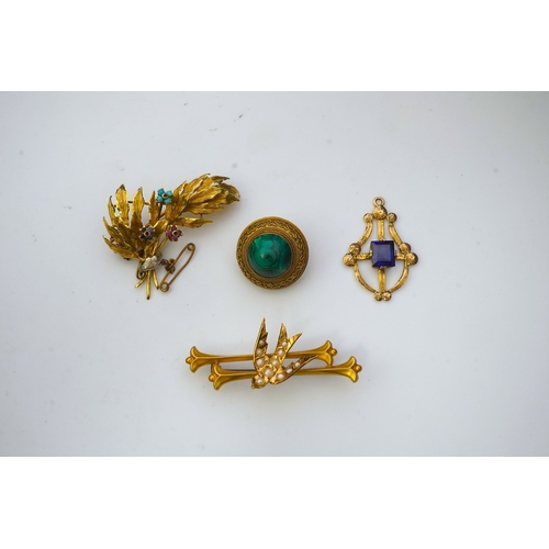 164 - A collection of three brooches and a pendant, 19th and 20th century, comprising: a synthetic sapphir... 