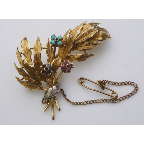 164 - A collection of three brooches and a pendant, 19th and 20th century, comprising: a synthetic sapphir... 