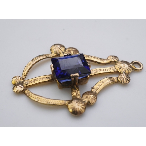 164 - A collection of three brooches and a pendant, 19th and 20th century, comprising: a synthetic sapphir... 