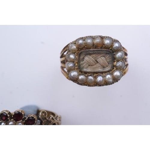 183 - A George III seed pearl mourning ring and a garnet and seed pearl ring, mid 19th century, the seed p... 