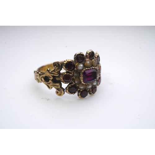 183 - A George III seed pearl mourning ring and a garnet and seed pearl ring, mid 19th century, the seed p... 