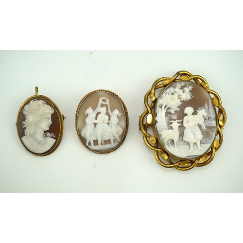 188 - Three shell cameo brooches, 20th century comprising: one depicting a young girl holding a baby goat ... 