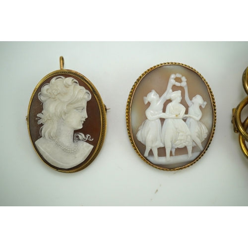 188 - Three shell cameo brooches, 20th century comprising: one depicting a young girl holding a baby goat ... 