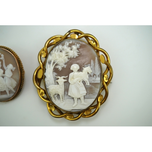 188 - Three shell cameo brooches, 20th century comprising: one depicting a young girl holding a baby goat ... 