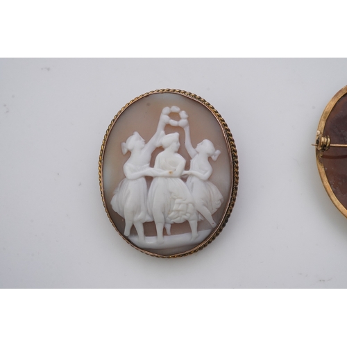 188 - Three shell cameo brooches, 20th century comprising: one depicting a young girl holding a baby goat ... 