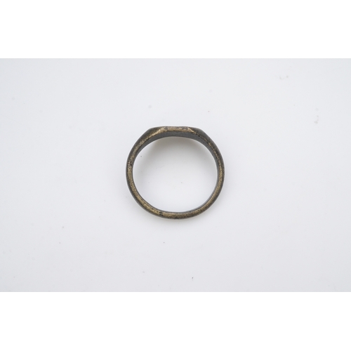 190 - A medieval bronze iconographic ring, France, 15th century, the elongated octagonal central panel eng... 