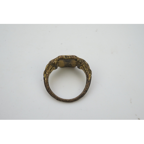 192 - A Tudor bronze signet ring, England, 16th century, the central hexagonal bezel carved with a bird wi... 