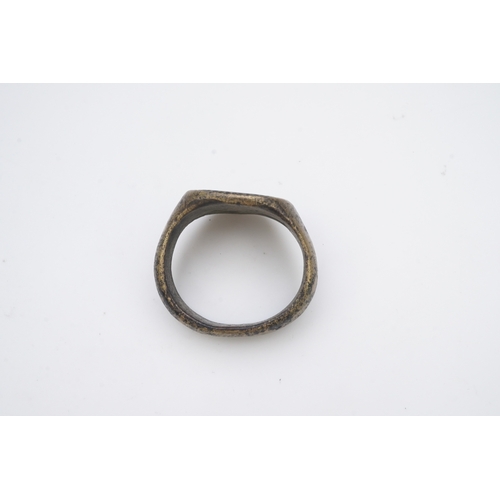 193 - A bronze signet ring, France, 15th/16th century, the circular central panel engraved with a fleur-de... 