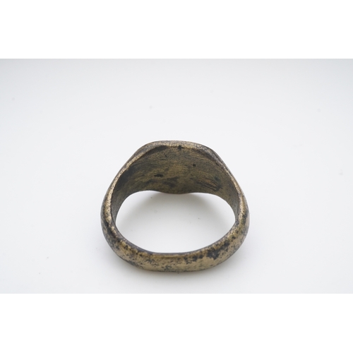 193 - A bronze signet ring, France, 15th/16th century, the circular central panel engraved with a fleur-de... 