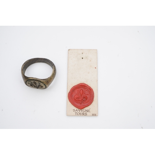 193 - A bronze signet ring, France, 15th/16th century, the circular central panel engraved with a fleur-de... 