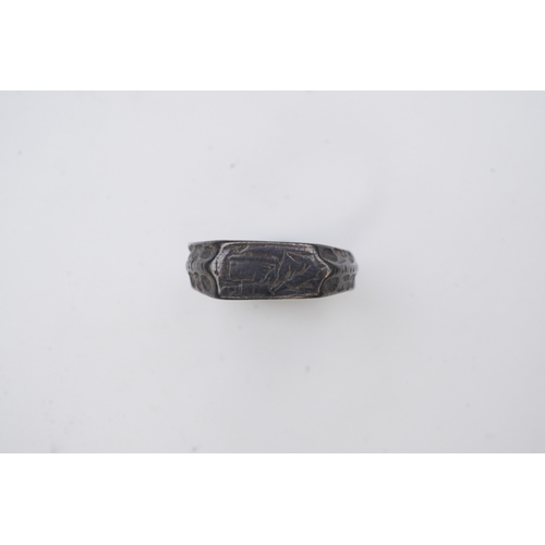 196 - A medieval iconographic ring, England, 14th/15th century the front engraved with a cowled bust of a ... 