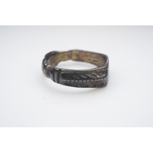 196 - A medieval iconographic ring, England, 14th/15th century the front engraved with a cowled bust of a ... 