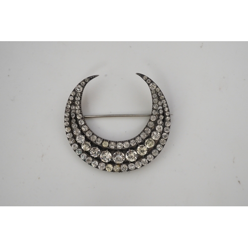 200 - A paste brooch, 19th century, designed as a crescent moon, set with circular-cut pastes in closed se... 