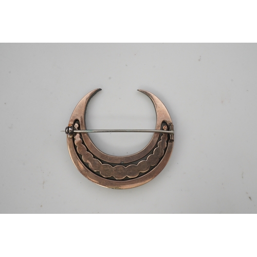 200 - A paste brooch, 19th century, designed as a crescent moon, set with circular-cut pastes in closed se... 