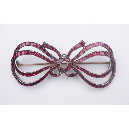 201 - A garnet brooch, late 18th/early 19th century designed as a ribbon bow, set with table-cut garnets i... 