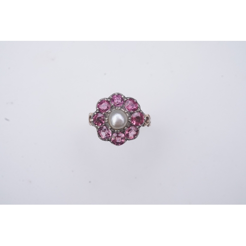 207 - A pearl and pink tourmaline ring, of cluster design, centring on a pearl within a border of circular... 