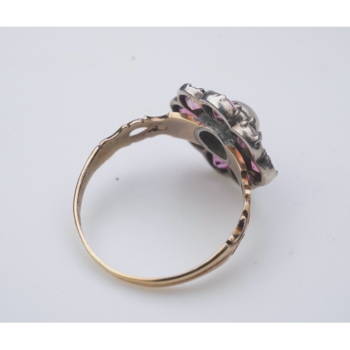 207 - A pearl and pink tourmaline ring, of cluster design, centring on a pearl within a border of circular... 