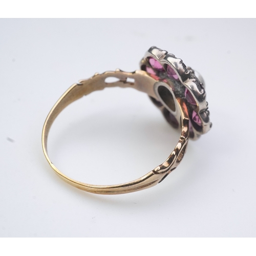 207 - A pearl and pink tourmaline ring, of cluster design, centring on a pearl within a border of circular... 