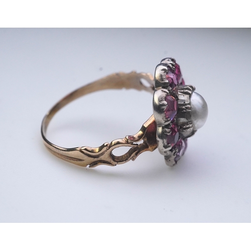 207 - A pearl and pink tourmaline ring, of cluster design, centring on a pearl within a border of circular... 