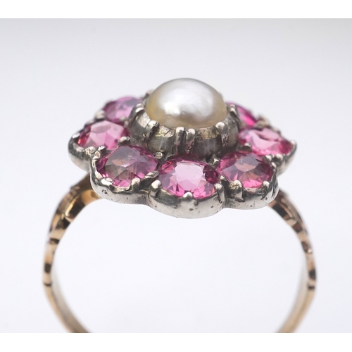 207 - A pearl and pink tourmaline ring, of cluster design, centring on a pearl within a border of circular... 