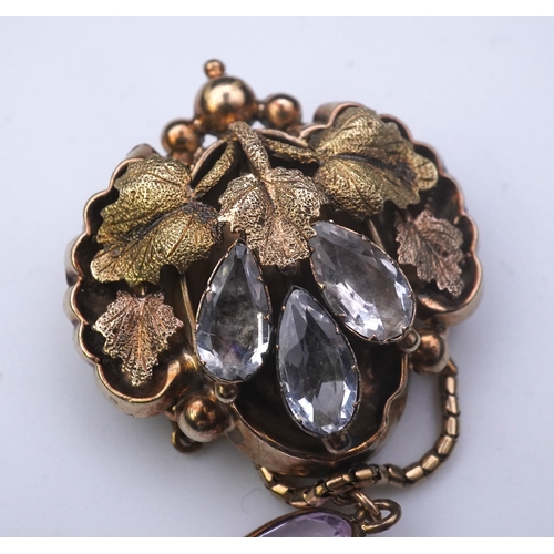 210 - A topaz brooch, mid 19th century, designed as a canopy of varicoloured grape leaves, set with pear-s... 