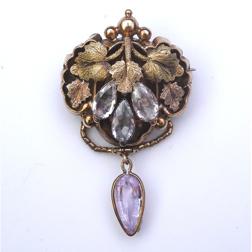 210 - A topaz brooch, mid 19th century, designed as a canopy of varicoloured grape leaves, set with pear-s... 