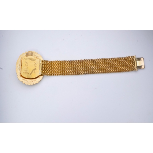 212 - A fine sentimental Georgian gold and hairwork bracelet, 1820s, the oval clasp centring on a glazed c... 