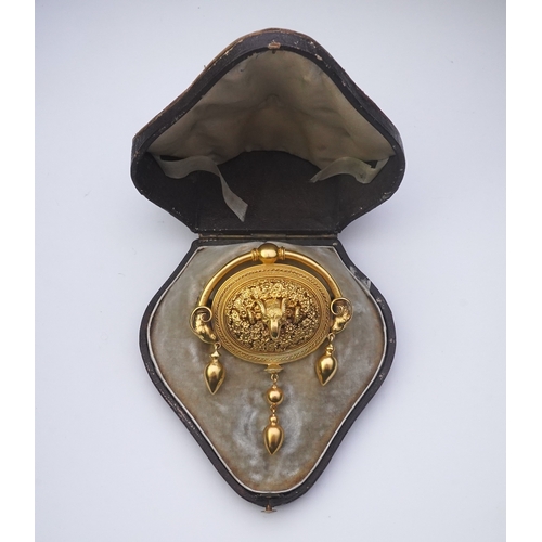 213 - An Archaeological Revival gold brooch, Papal States, 1860s, composed of an oval panel intricately mo... 