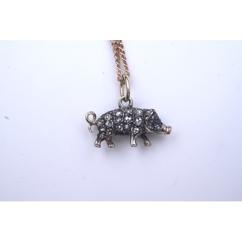 215 - A diamond pendant, designed as a pig, set with rose-cut diamonds, its eye set with a ruby, to a late... 