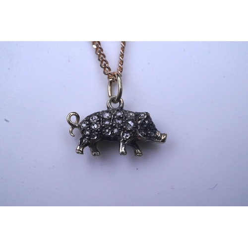 215 - A diamond pendant, designed as a pig, set with rose-cut diamonds, its eye set with a ruby, to a late... 