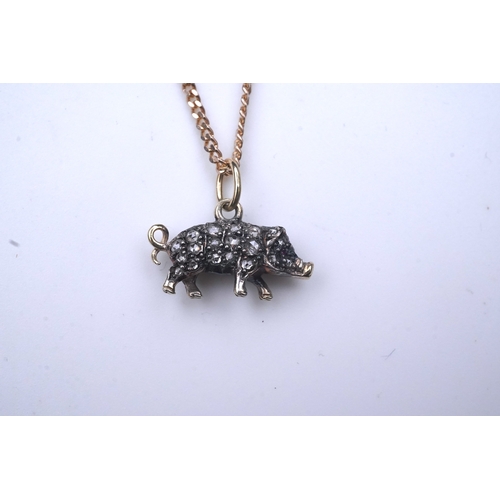 215 - A diamond pendant, designed as a pig, set with rose-cut diamonds, its eye set with a ruby, to a late... 