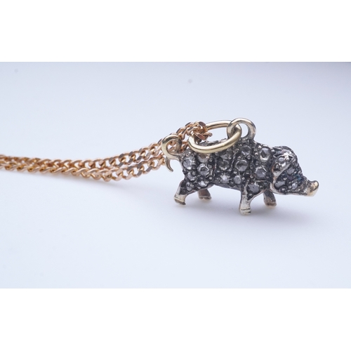 215 - A diamond pendant, designed as a pig, set with rose-cut diamonds, its eye set with a ruby, to a late... 