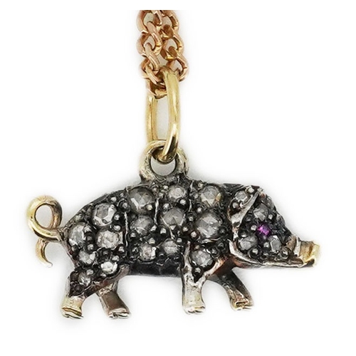 215 - A diamond pendant, designed as a pig, set with rose-cut diamonds, its eye set with a ruby, to a late... 